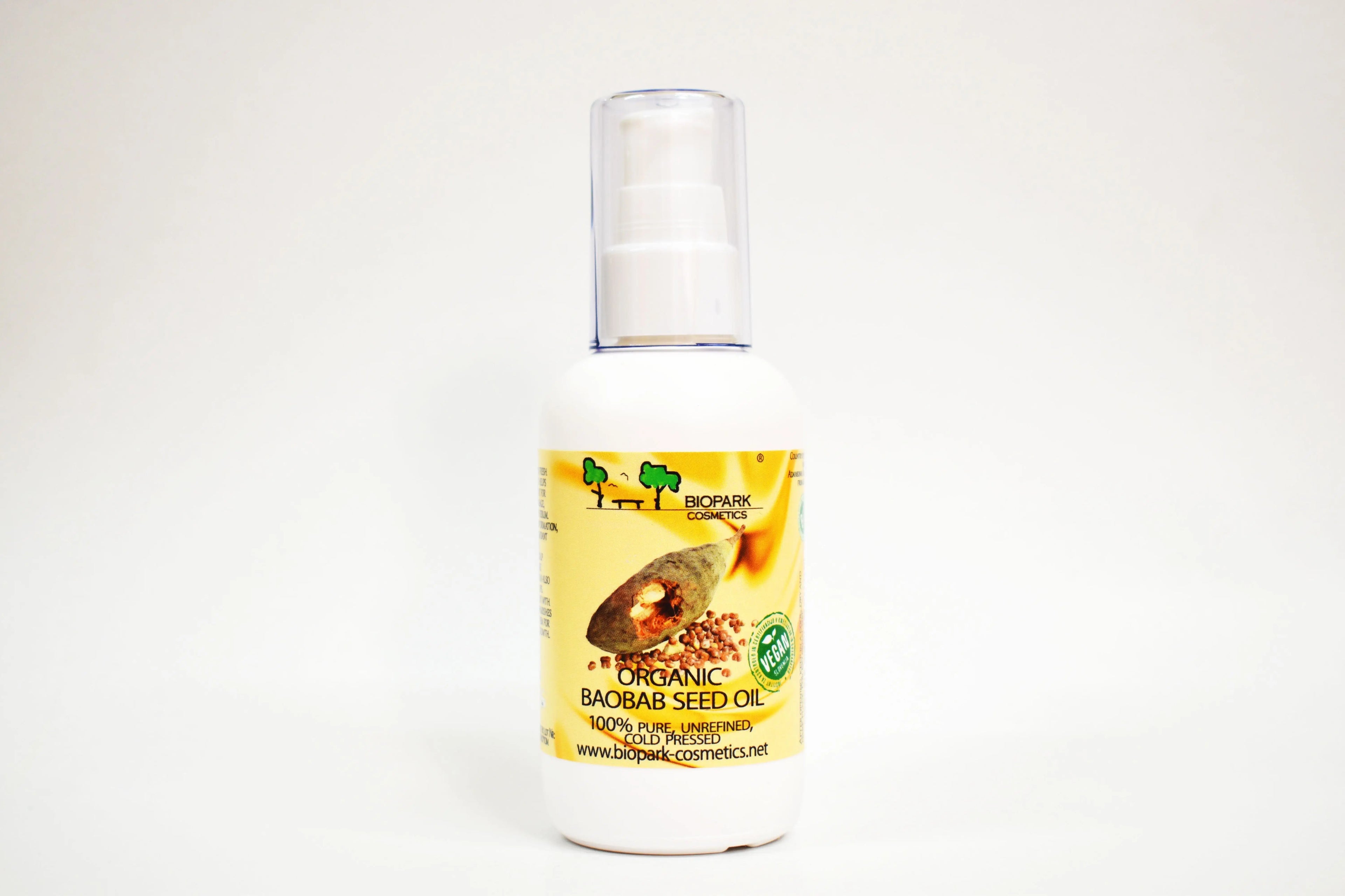 Bottle of organic baobab seed oil with a yellow label on a white background