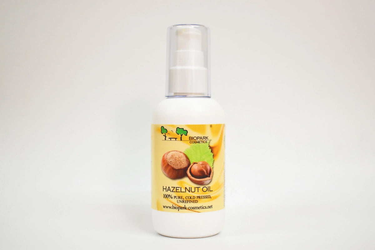Bottle of hazelnut oil with a yellow label on a white background
