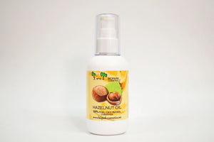Bottle of hazelnut oil with a yellow label on a white background