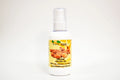 Bottle of organic argan oil with a yellow label on a white background