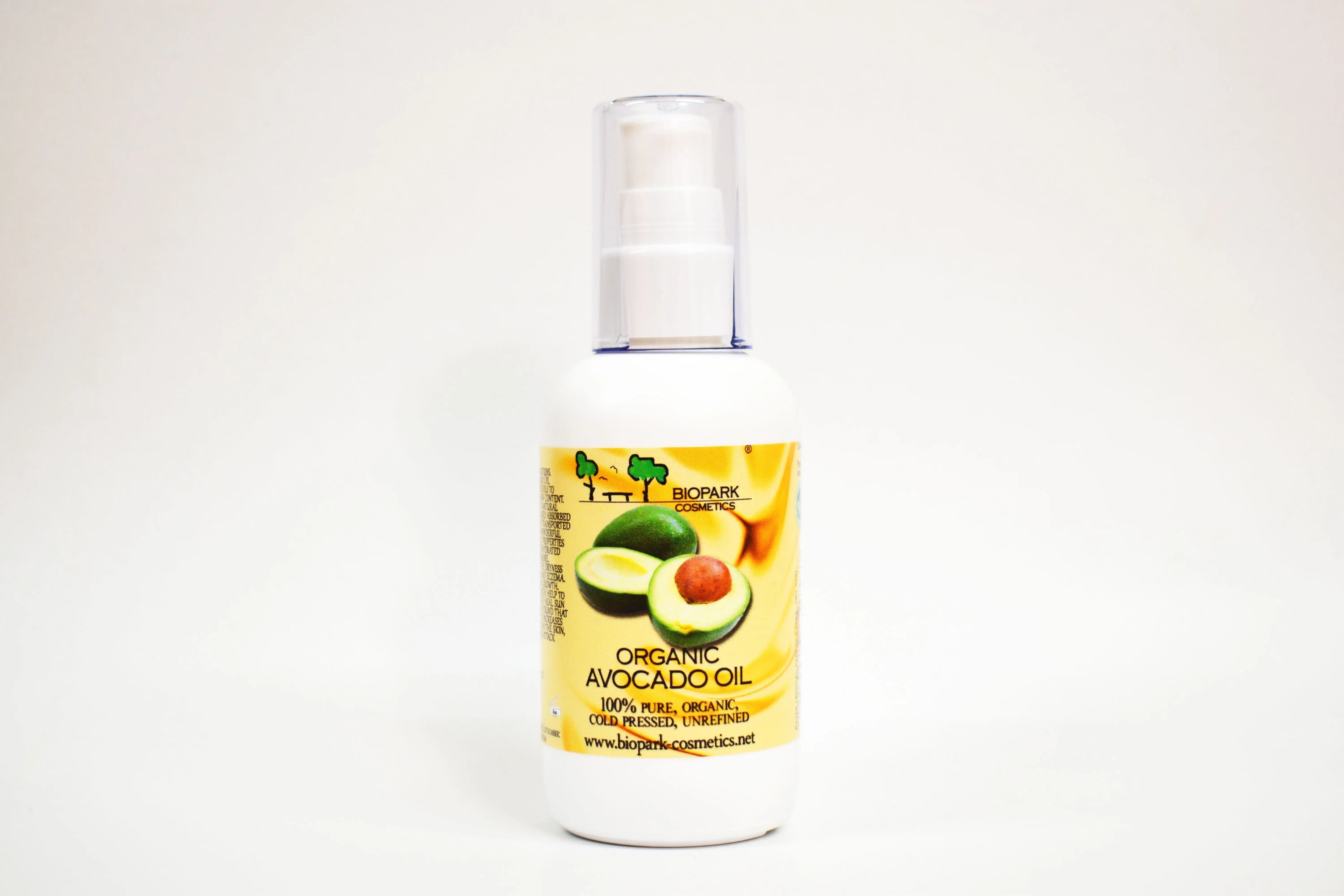 Bottle of organic avocado oil with a label on a white background