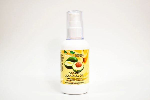 Bottle of organic avocado oil with a label on a white background