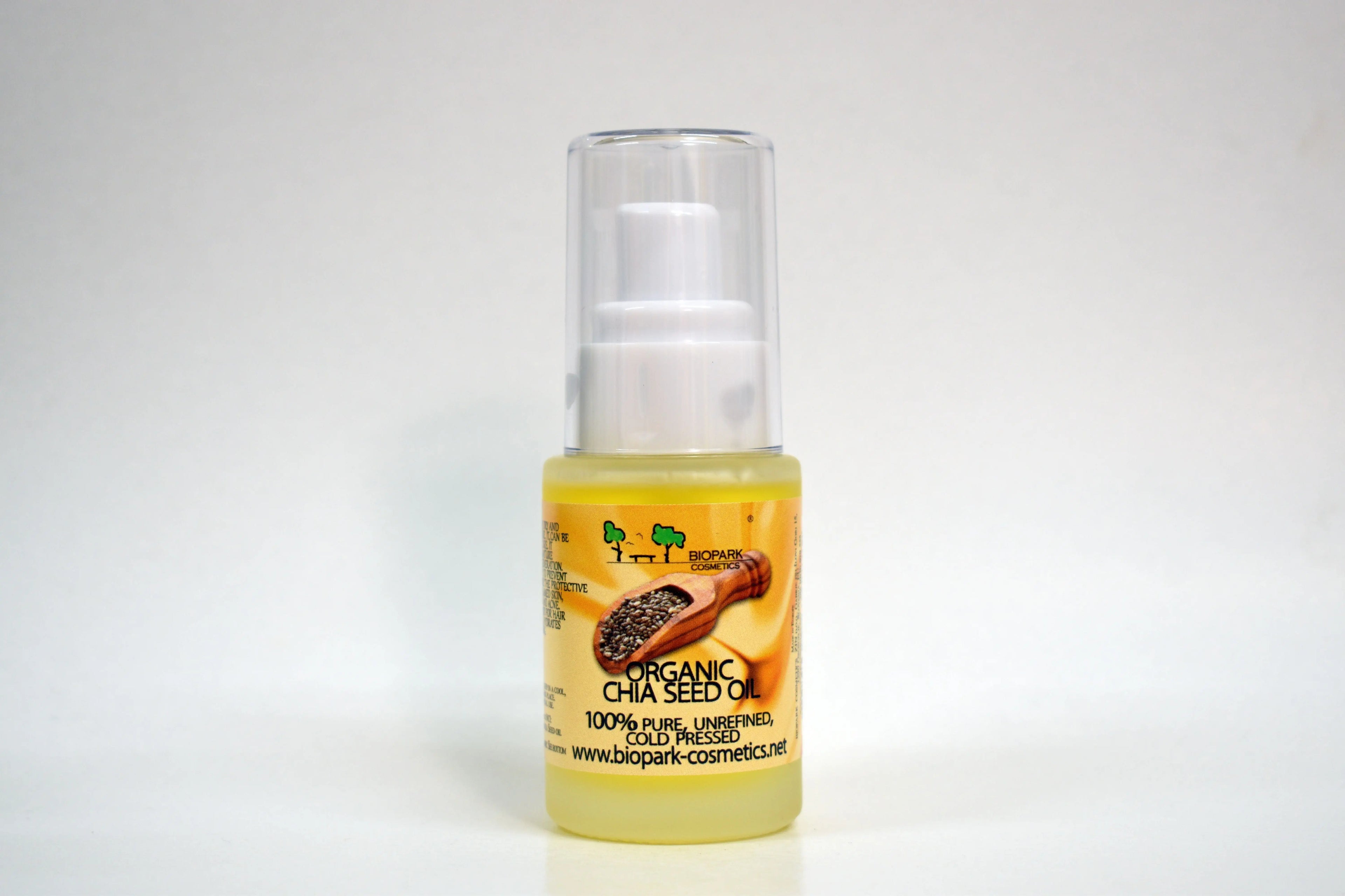 Bottle of organic chia seed oil with a white background