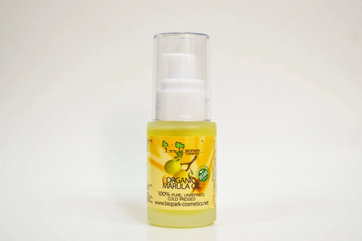 Bottle of organic marula oil on a white background