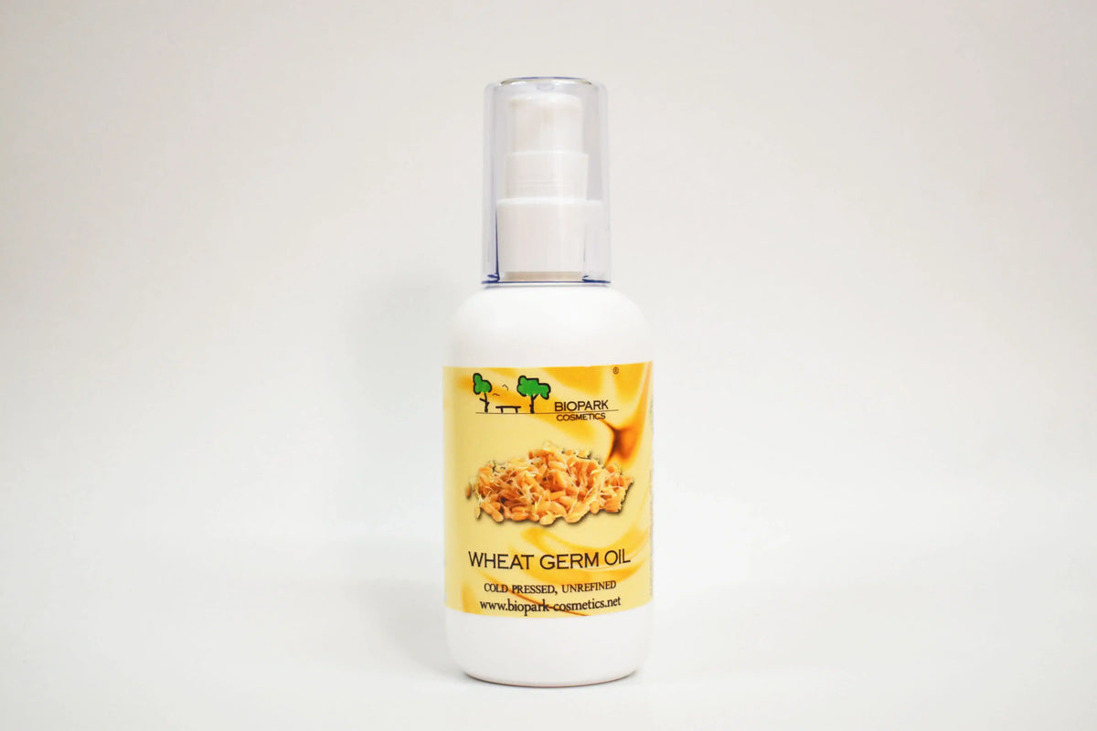 Bottle of wheat germ oil with a label on a white background