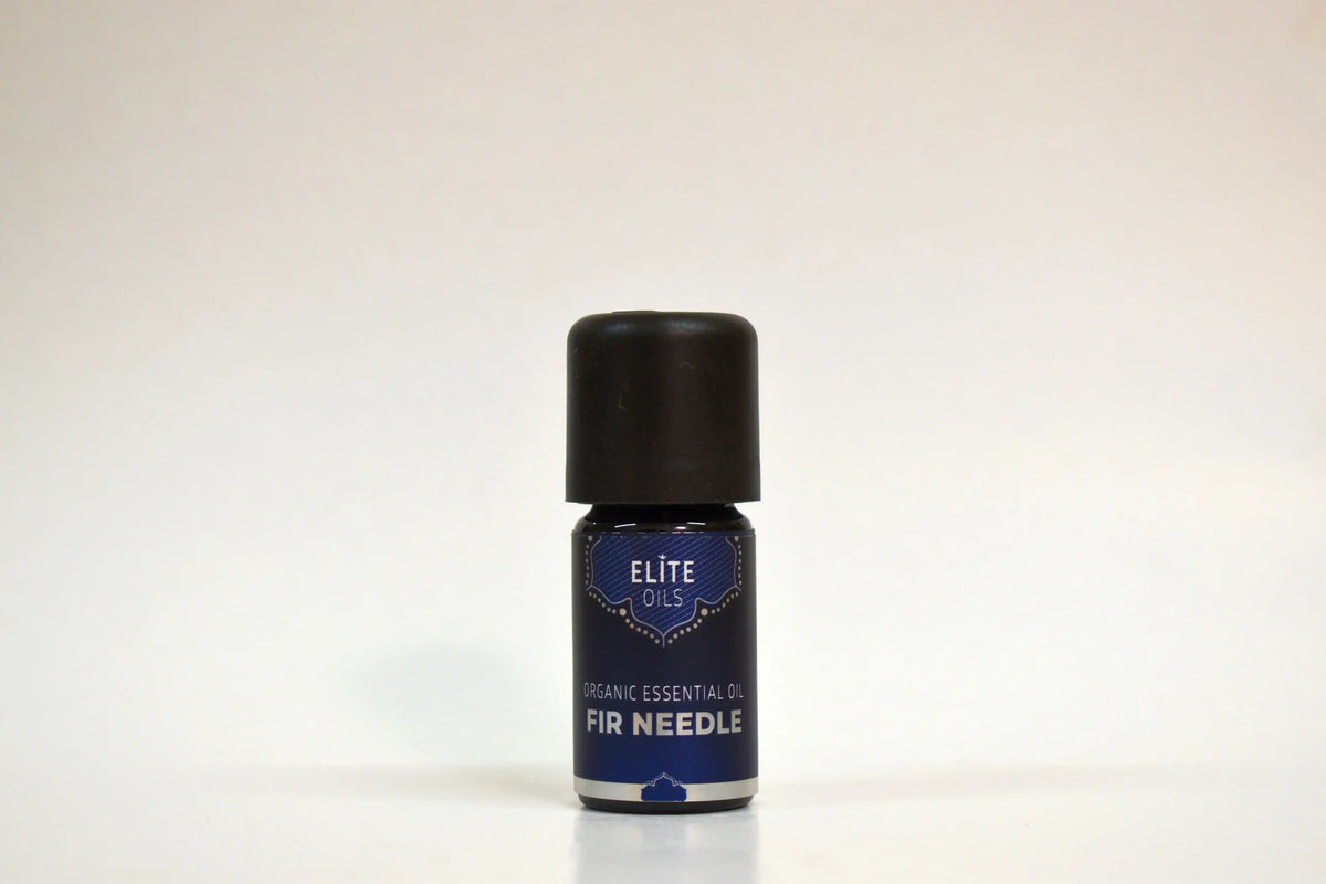 Bottle of Elite Oils Fir Needle essential oil on a white background