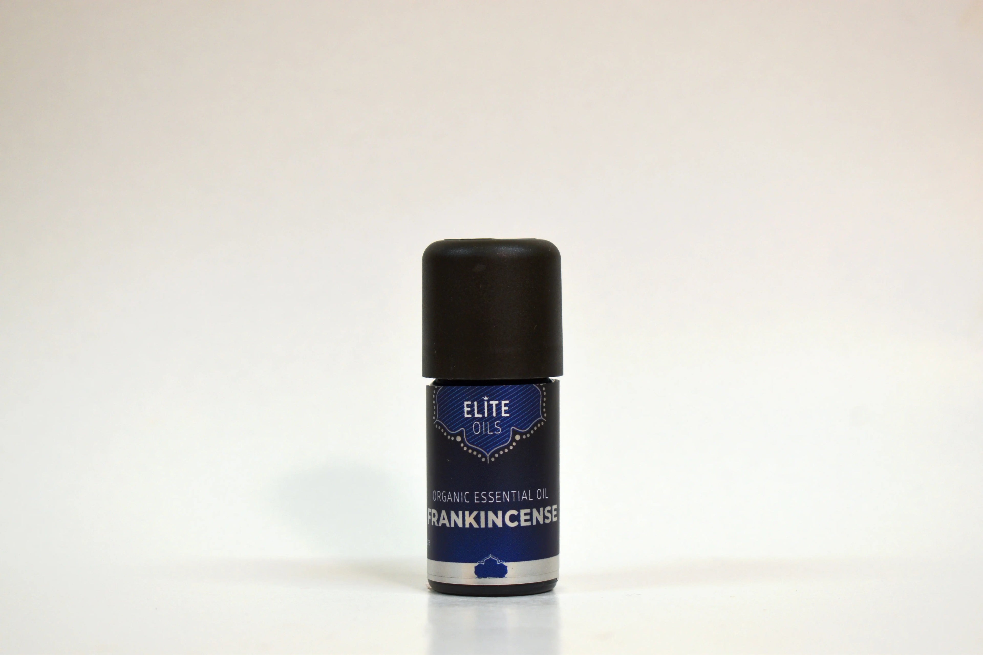 Roll-on bottle of frankincense essential oil by Elite Oils on a white background