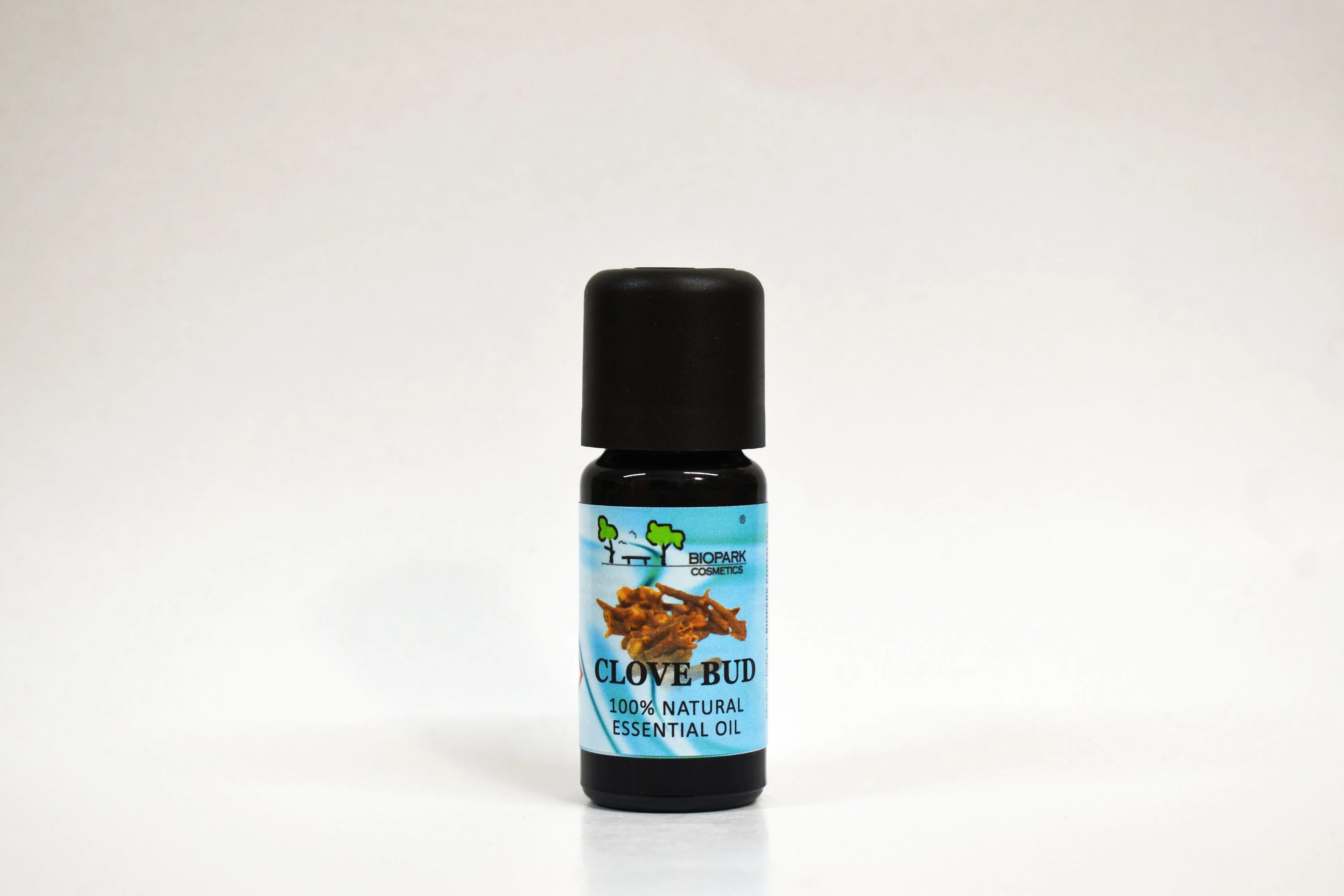 Bottle of clove bud essential oil on a white background