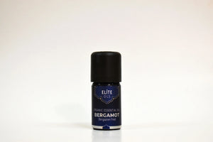 Bottle of Elite Oils Bergamot essential oil on a white background