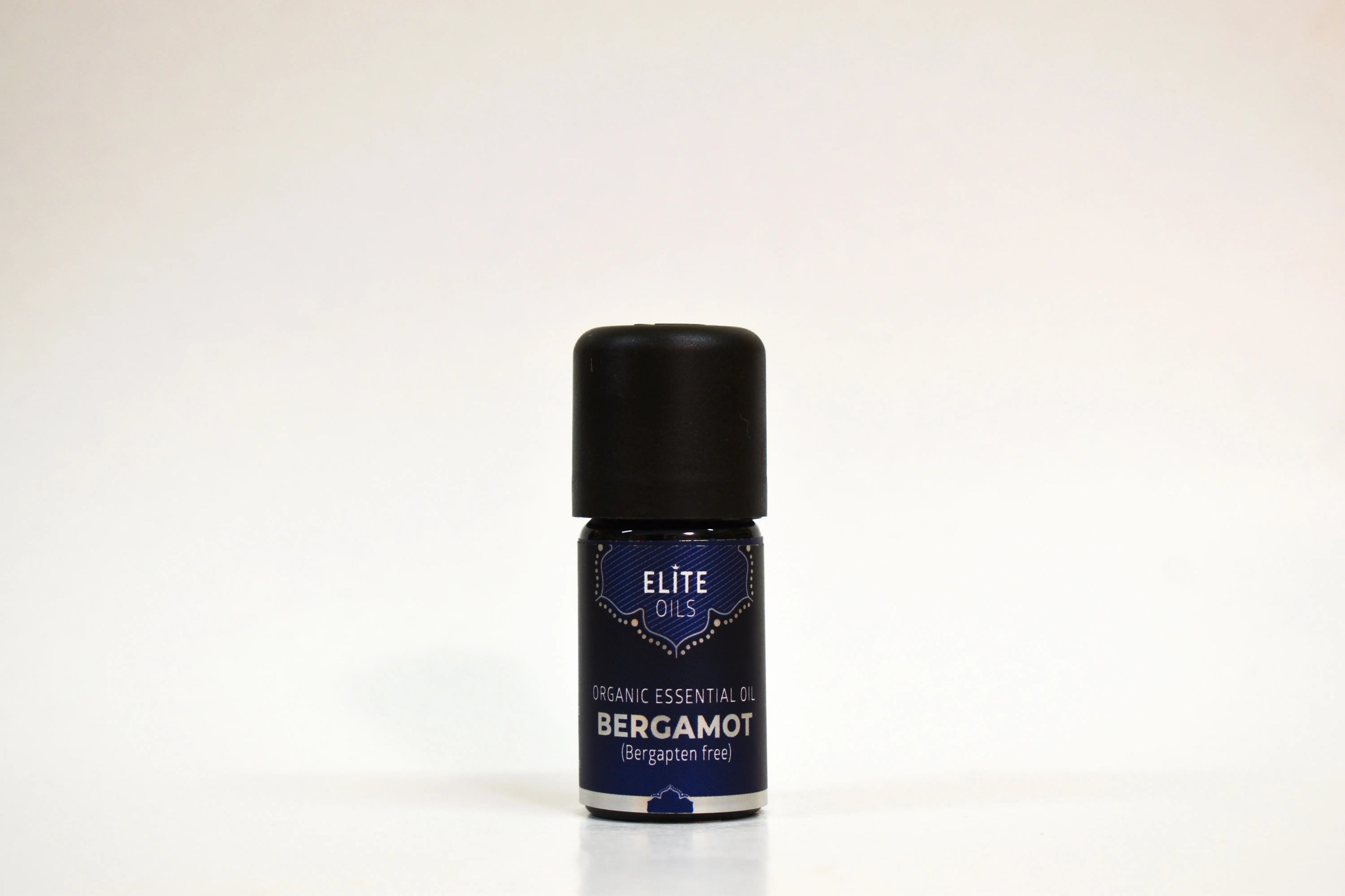 Bottle of Elite Oils Bergamot essential oil on a white background