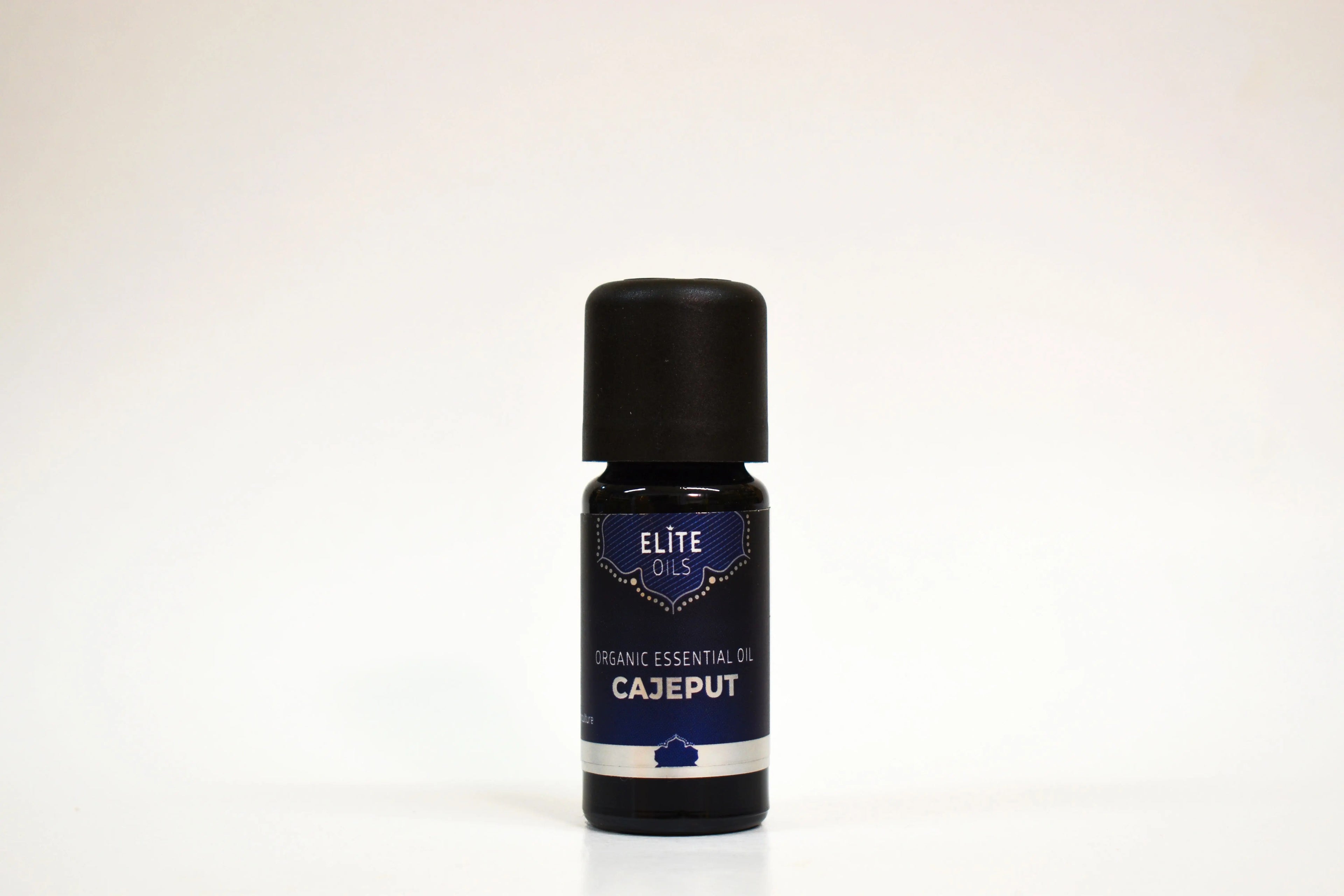 Bottle of Elite Oils Cajeput essential oil on a white background