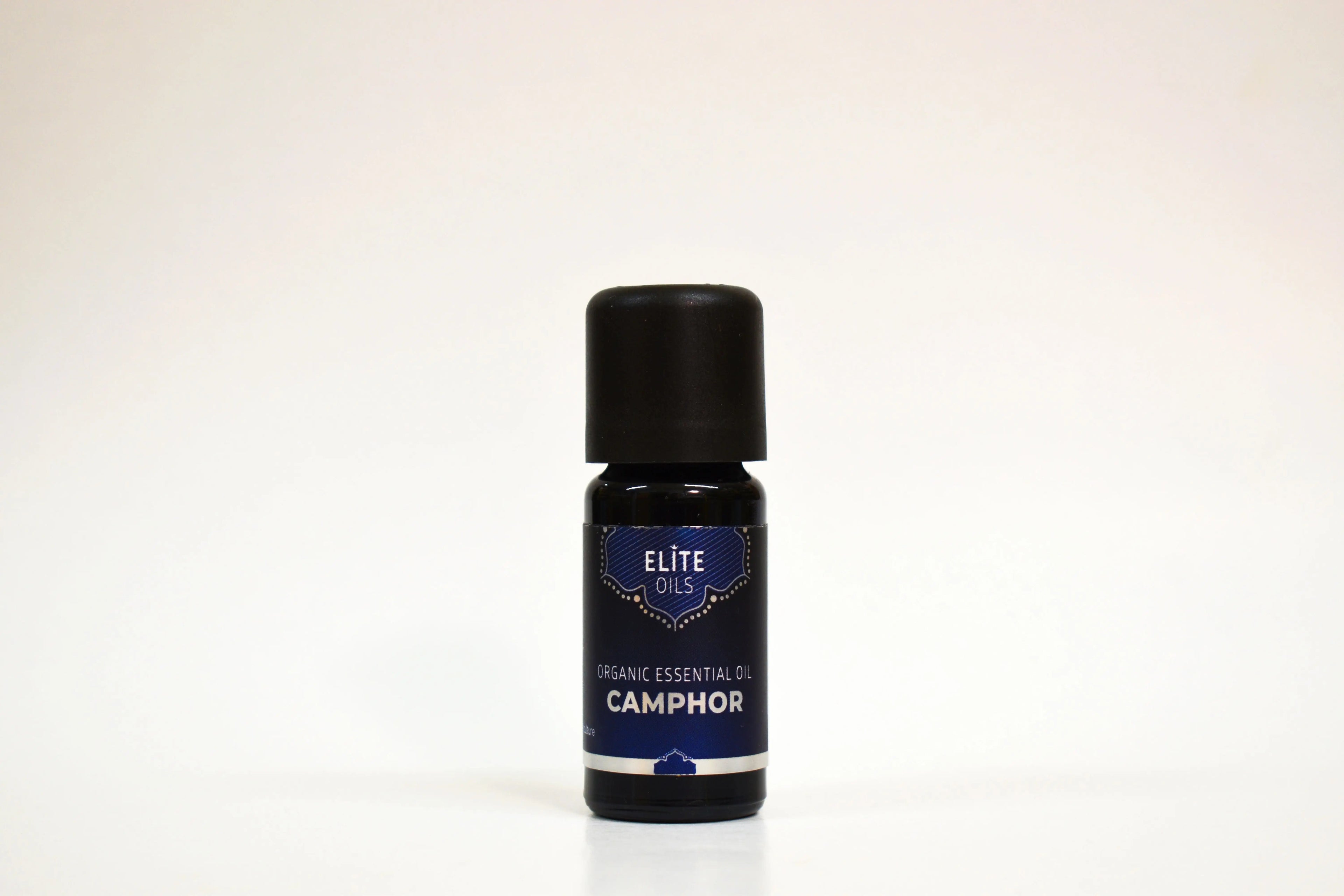Bottle of Elite Oils Camphor essential oil on a white background