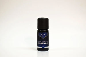 Bottle of Elite Oils Cedarwood essential oil on a white background