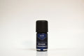 Bottle of Elite Oils Roman Chamomile essential oil on a white background