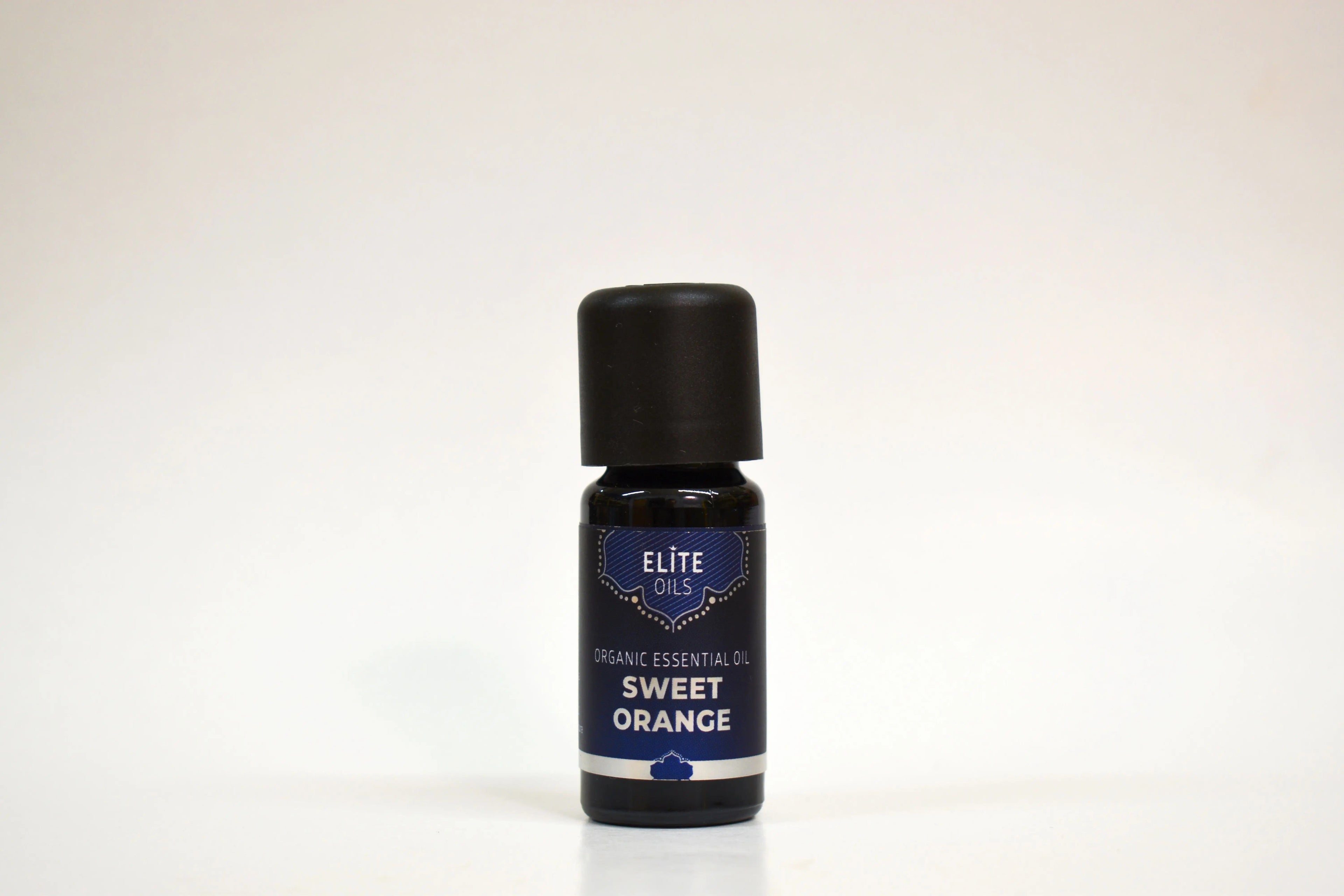 Bottle of Elite Oils Sweet Orange essential oil on a white background