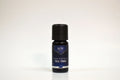 Bottle of Elite Oils Tea Tree essential oil on a white background