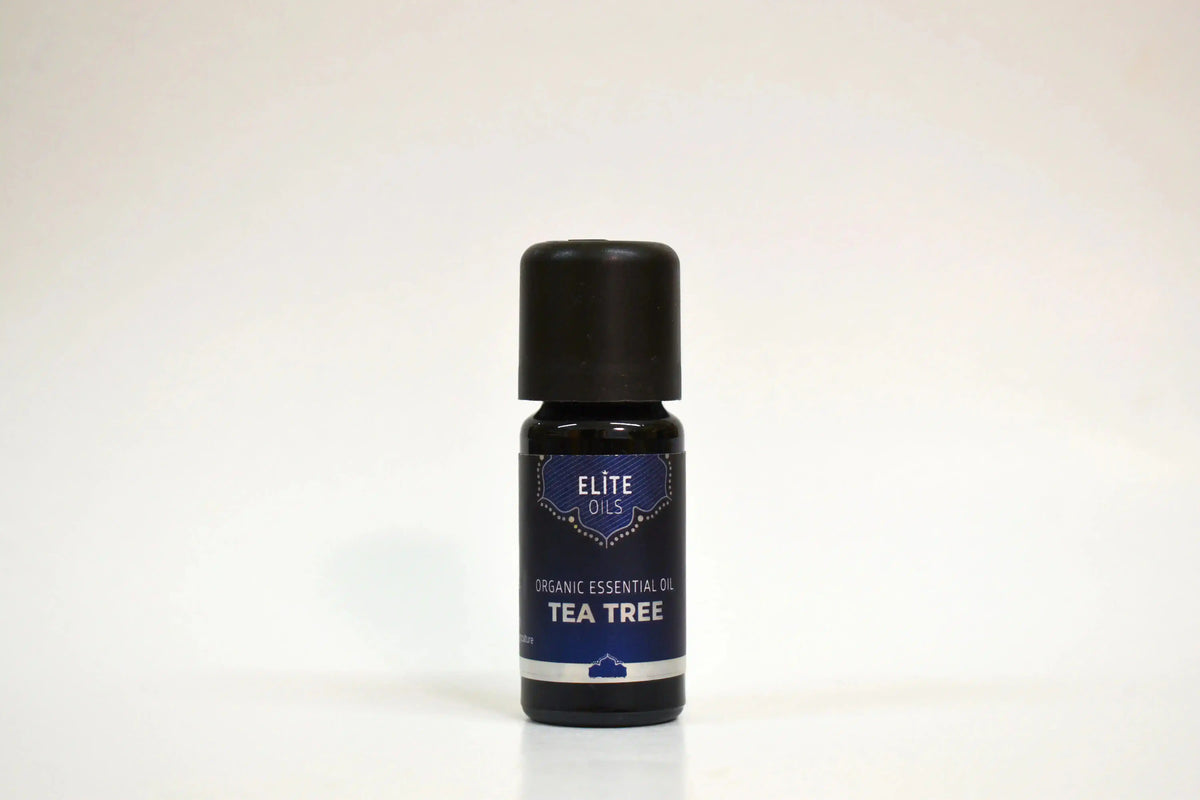 Bottle of Elite Oils Tea Tree essential oil on a white background