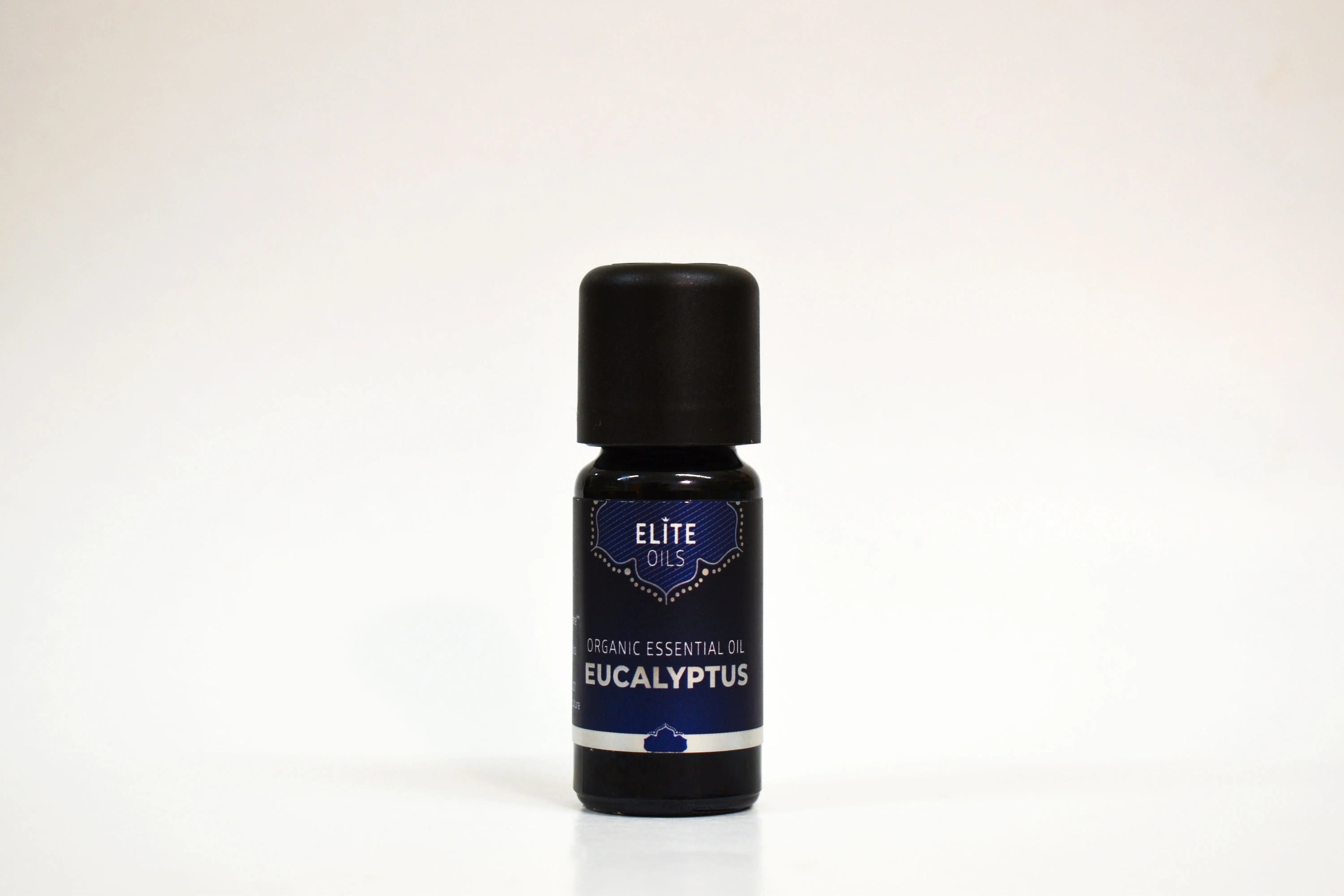 Bottle of Eucalyptus essential oil with a black cap on a white background