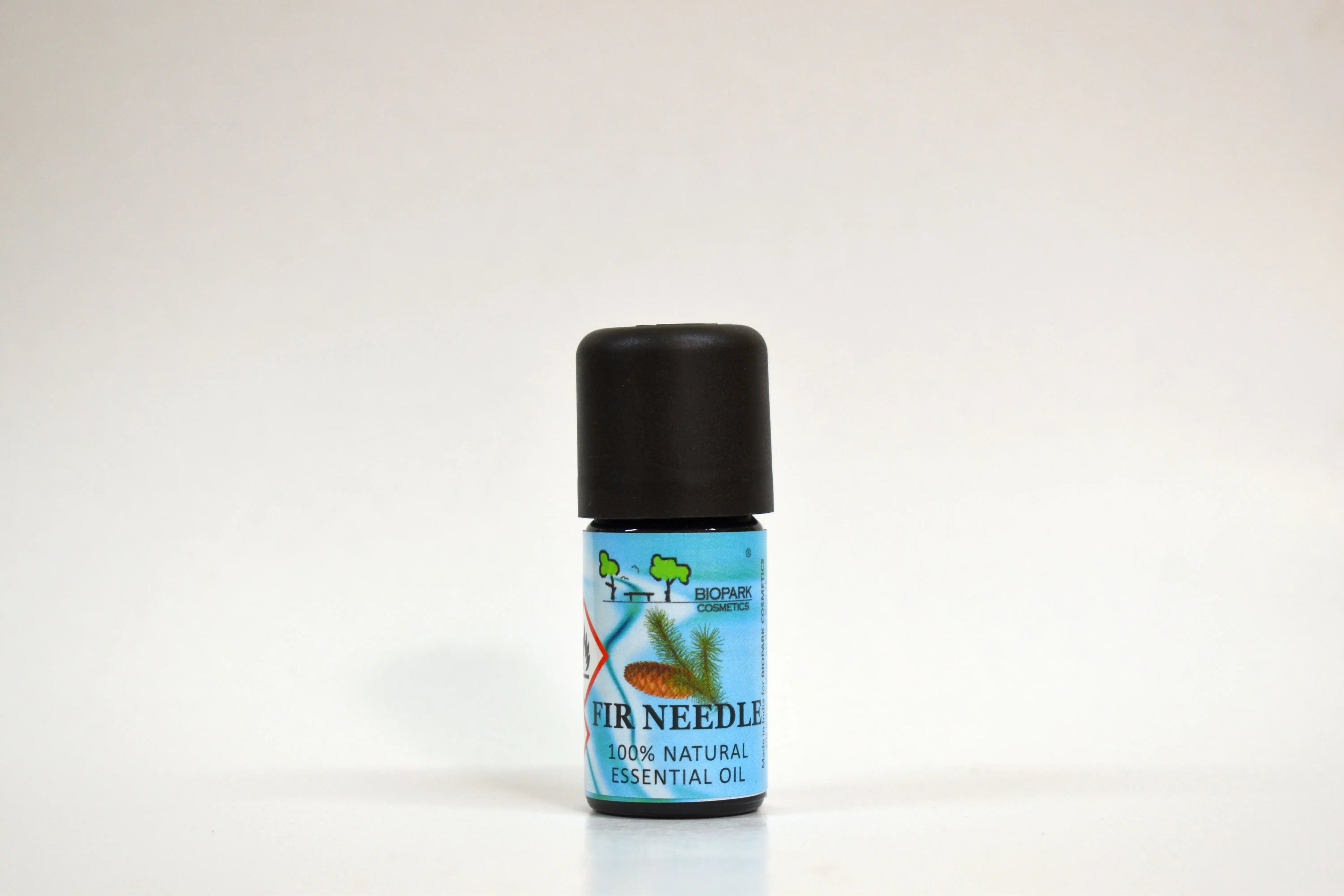 Essential oil bottle with a blue label on a white background
