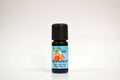 Grapefruit essential oil bottle with a blue label on a white background