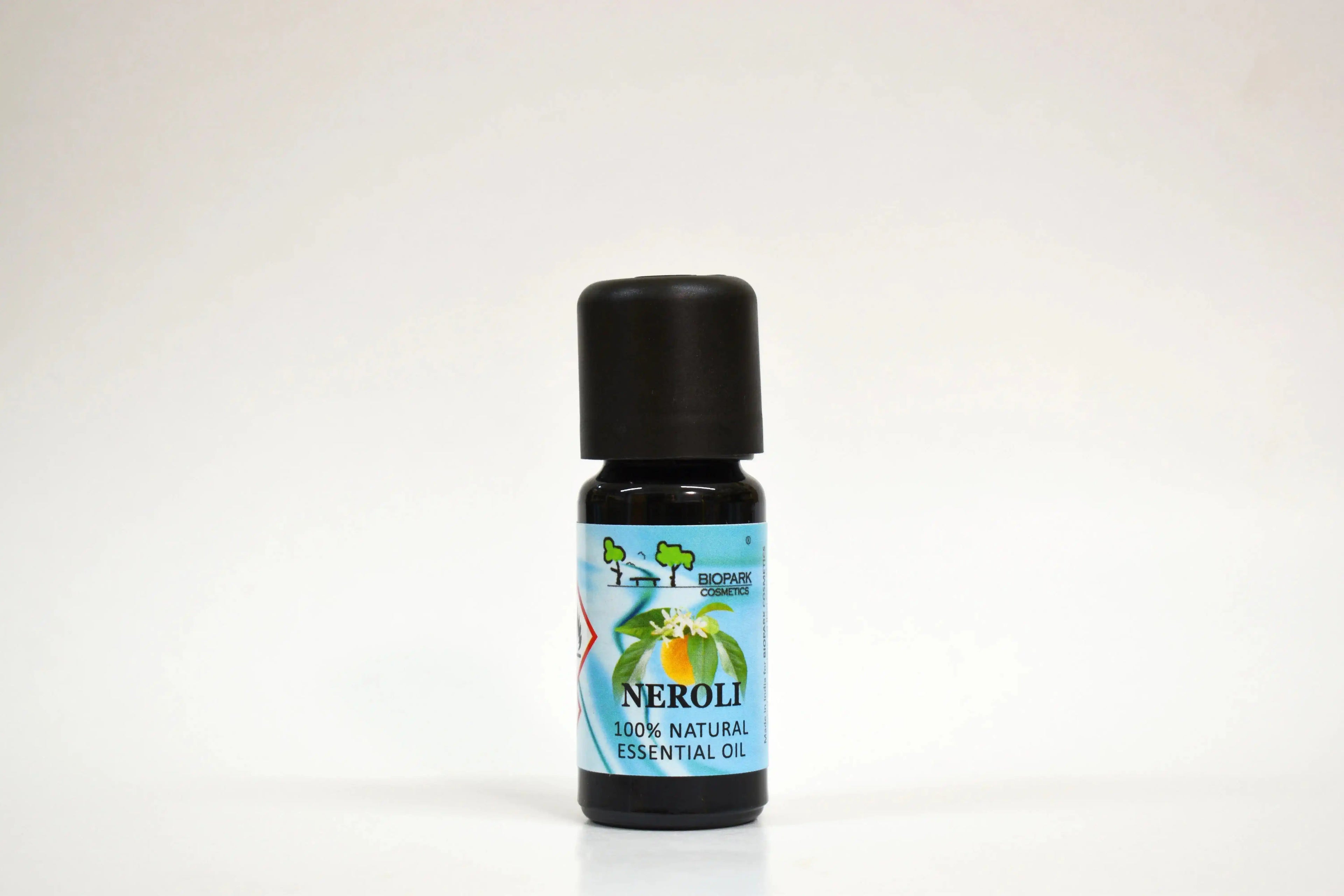 Bottle of Neroli essential oil on a white background