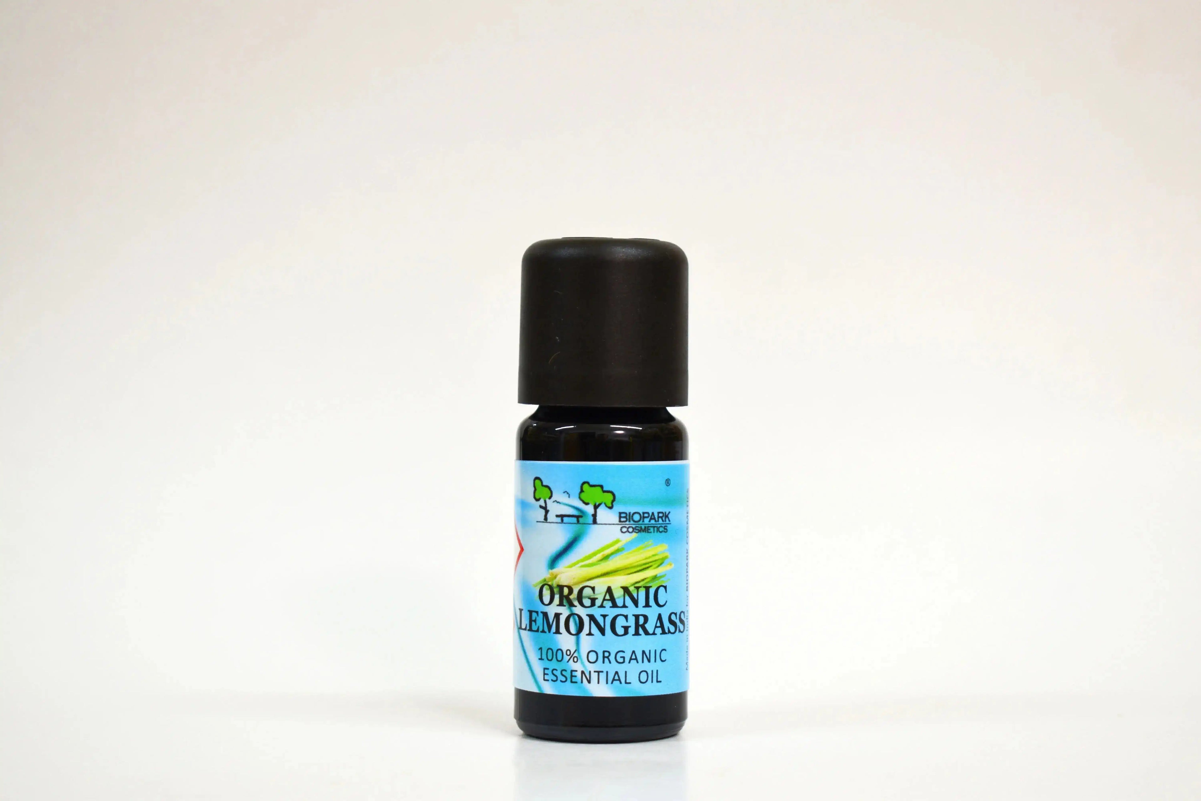 Bottle of organic lemongrass essential oil on a white background