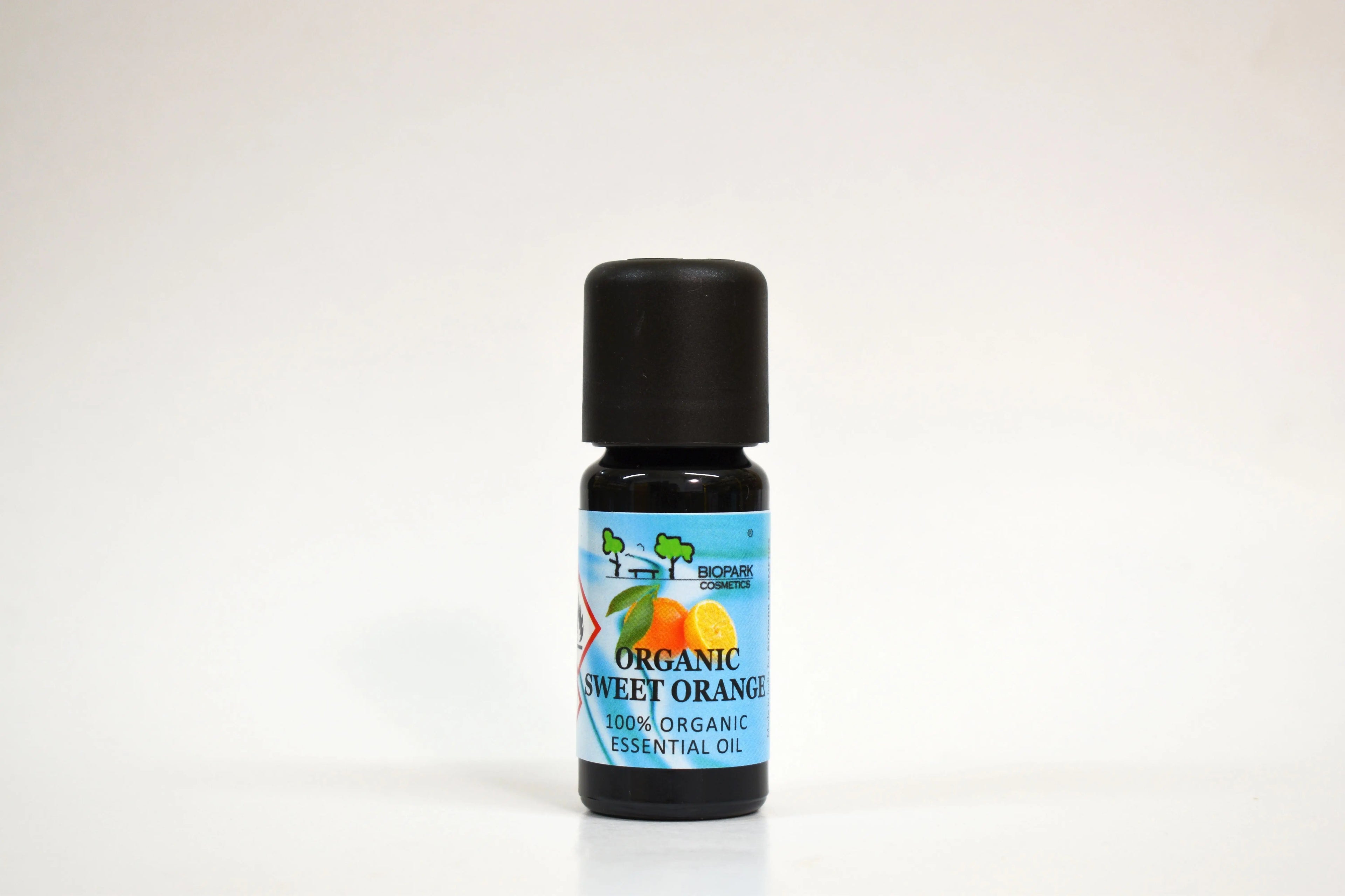 Bottle of organic sweet orange essential oil on a white background