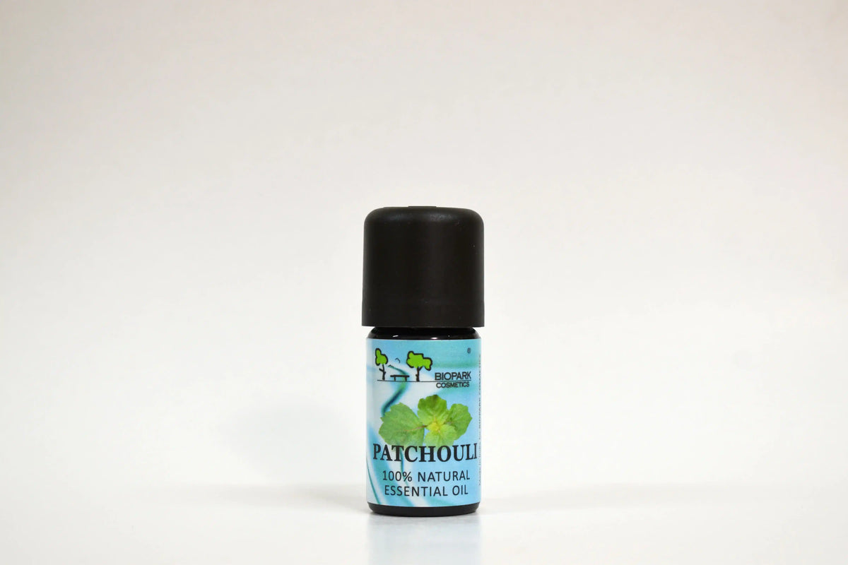 Patchouli essential oil bottle on a white background
