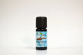 Bottle of rosewood essential oil on a white background