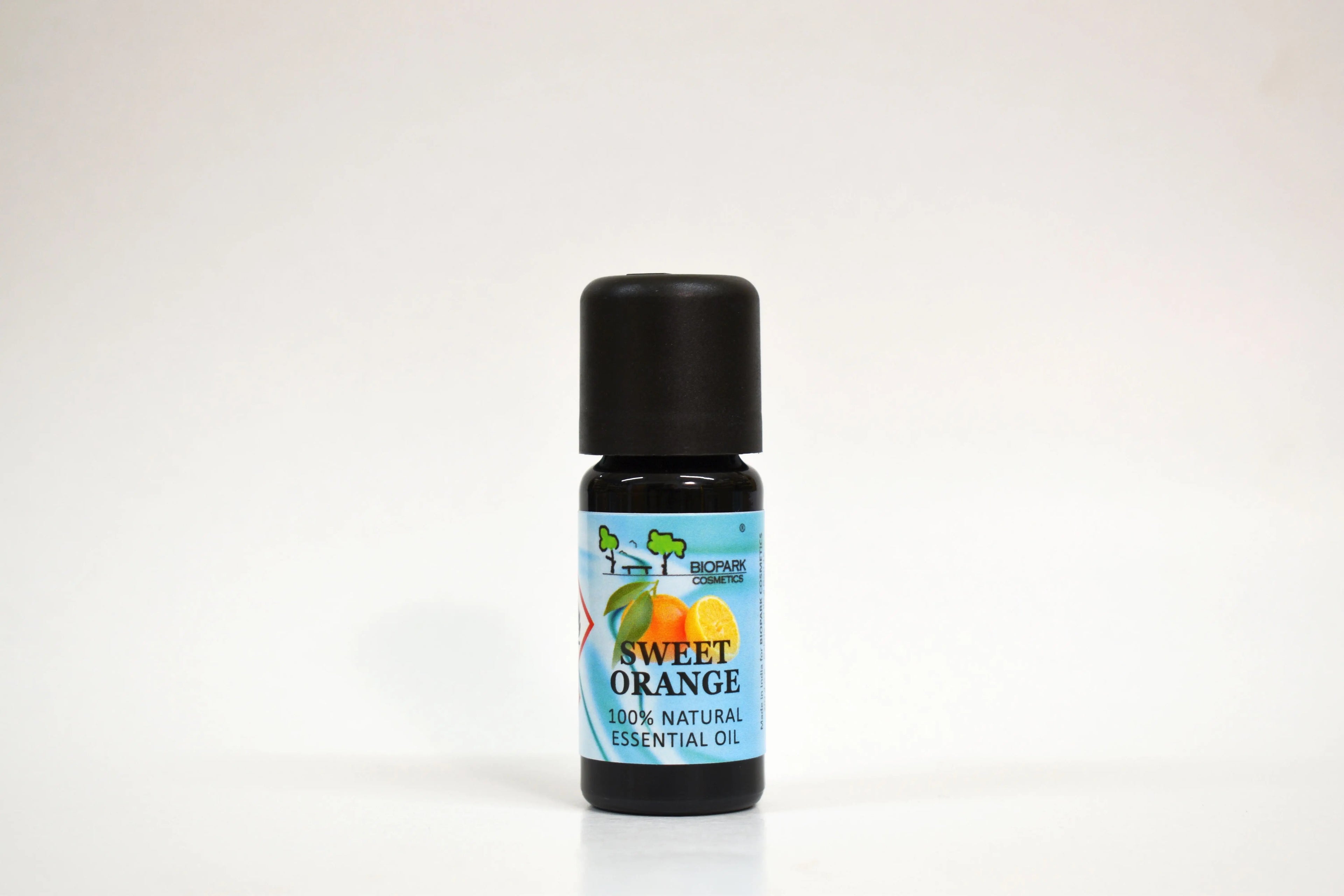 Bottle of sweet orange essential oil on a white background