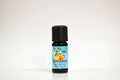 Bottle of tangerine essential oil on a white background