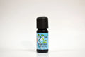 Tea tree essential oil bottle with a blue label on a white background