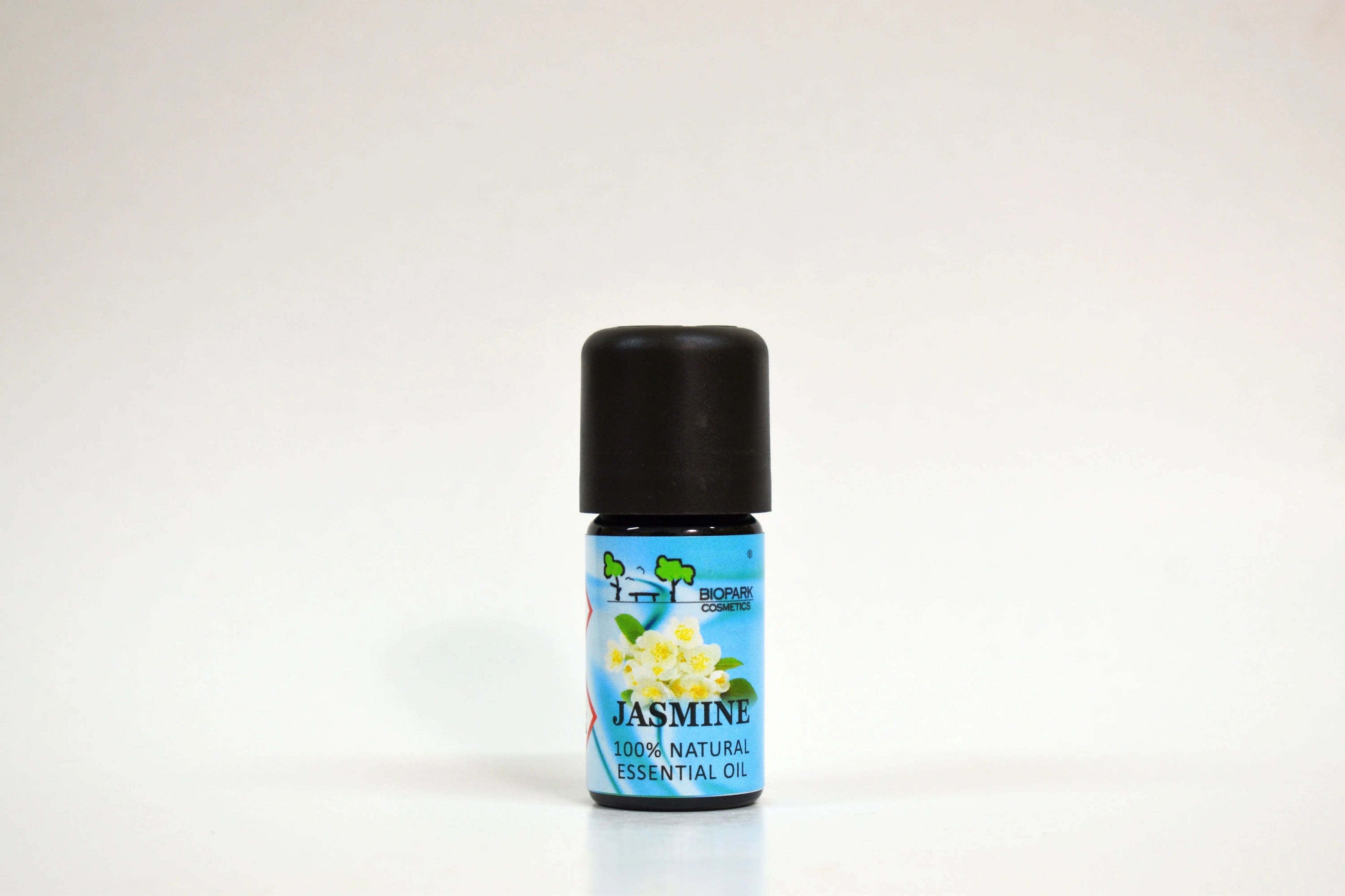 Essential oil bottle labeled 'Jasmine' on a white background