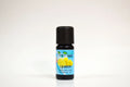 Bottle of lemon essential oil with a black cap on a white background