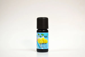 Bottle of lemon essential oil with a black cap on a white background