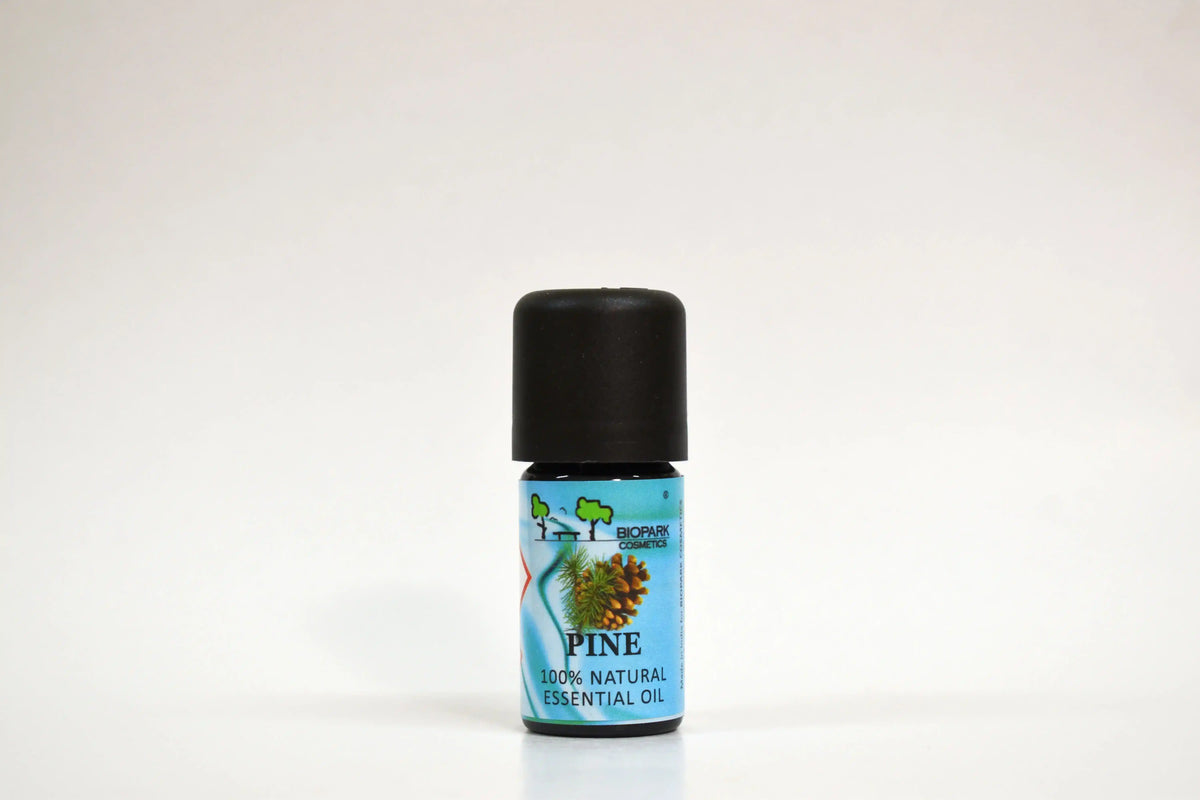 Bottle of pine essential oil on a white background