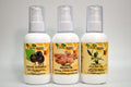 Three bottles of organic oils with visible labels on a gray background