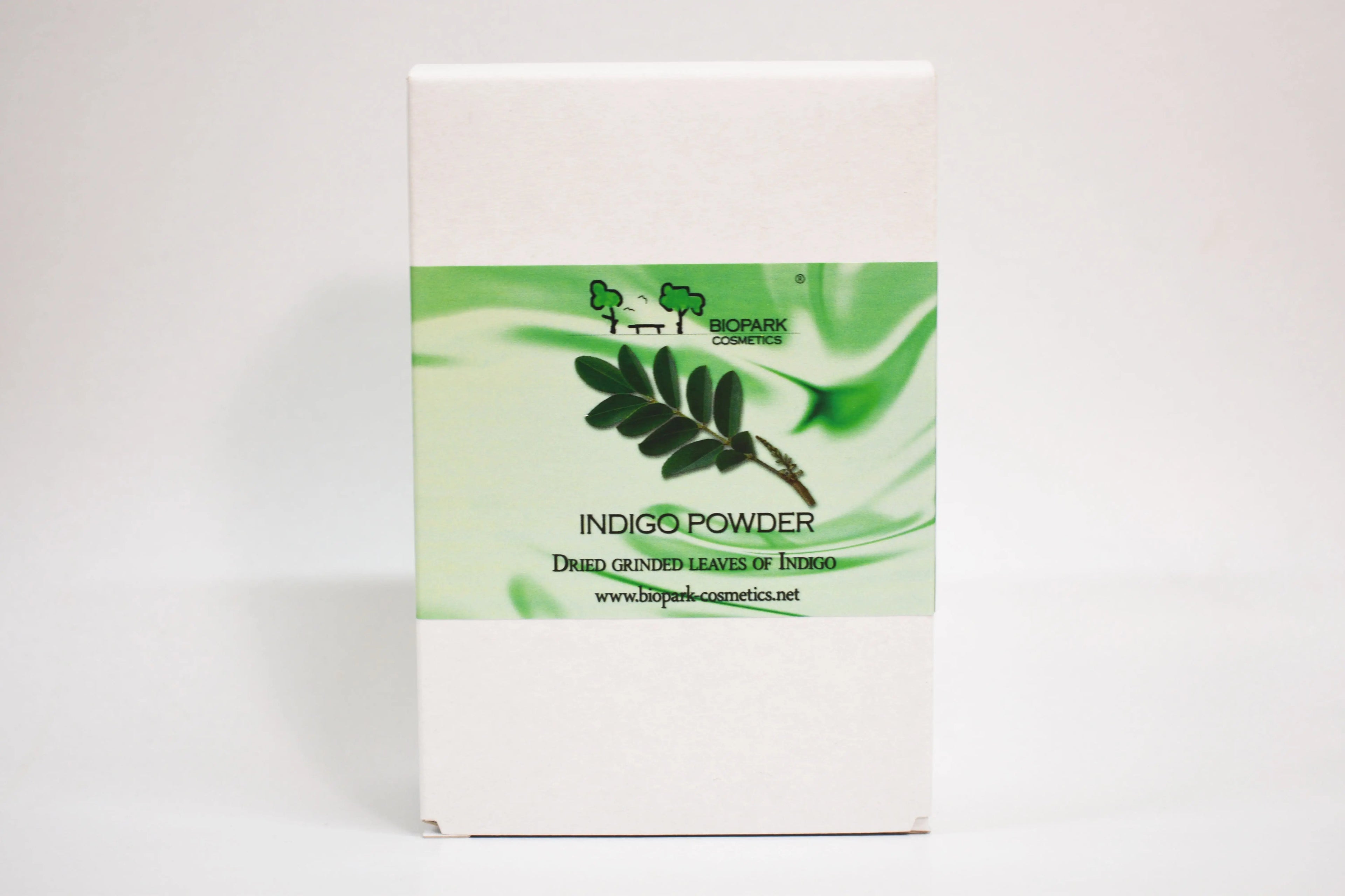 Box of Indigo Powder with green leaf design on a white background