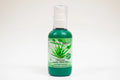 Bottle of organic aloe vera gel on a white background