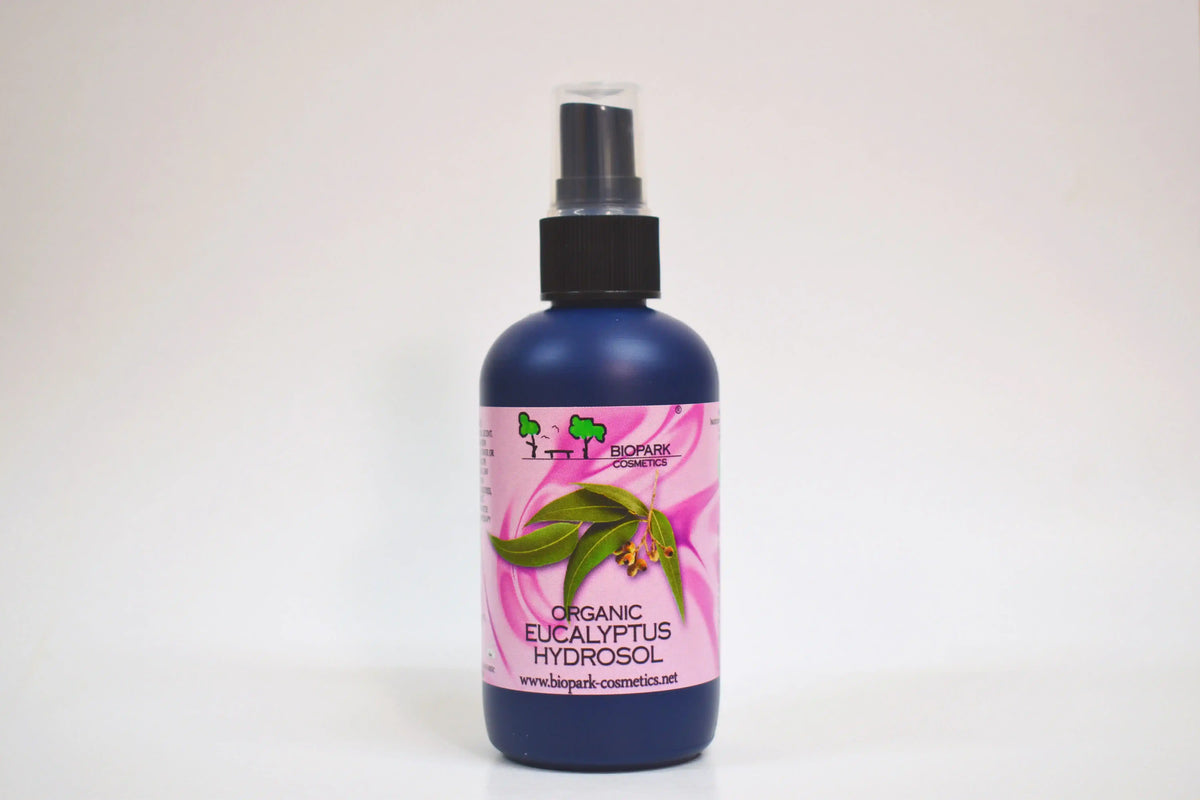 Bottle of organic eucalyptus hydrosol with a pink label on a white background