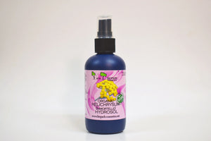 Bottle of organic helichrysum hydrofol on a white background