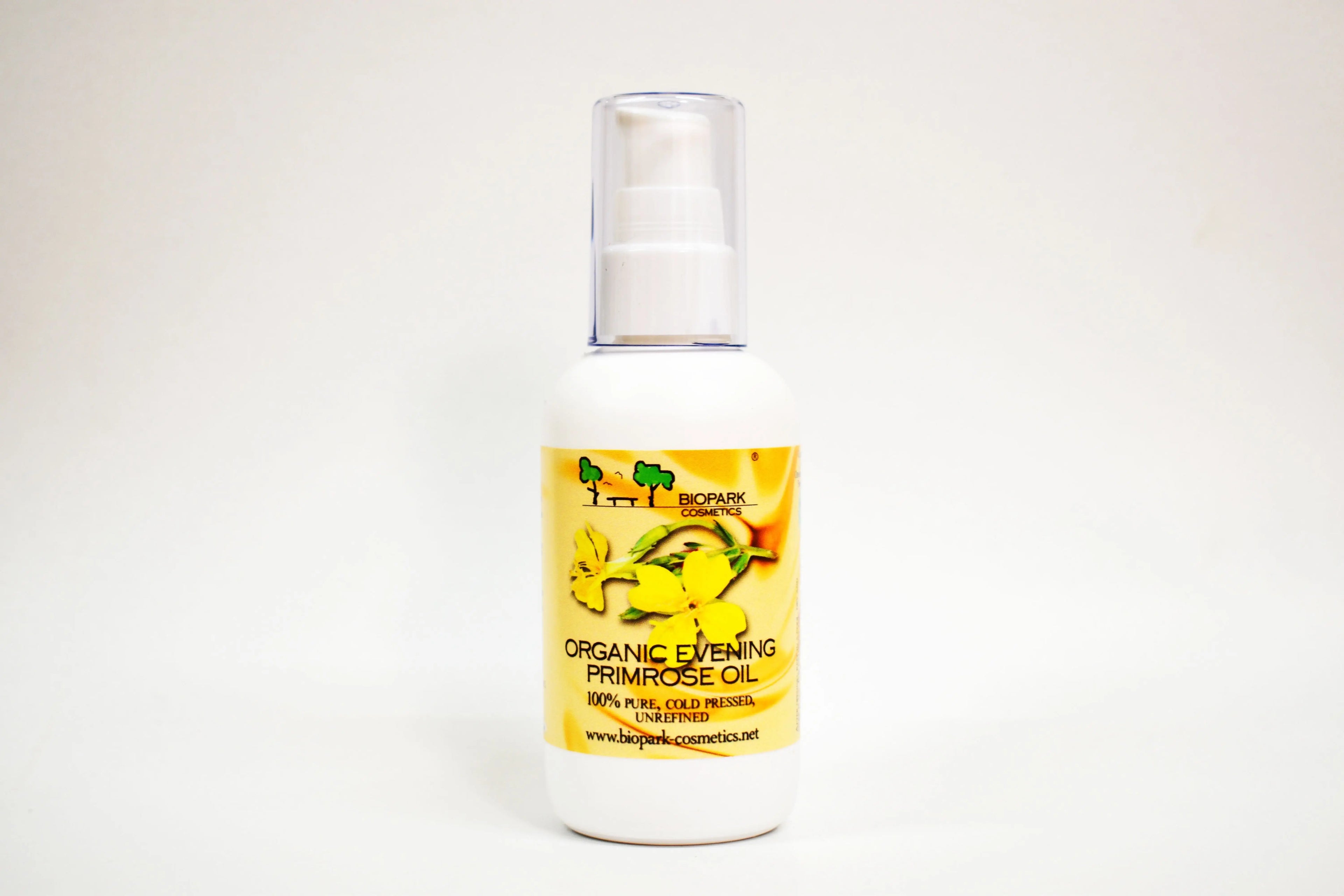 Bottle of organic evening primrose oil with a yellow label on a white background