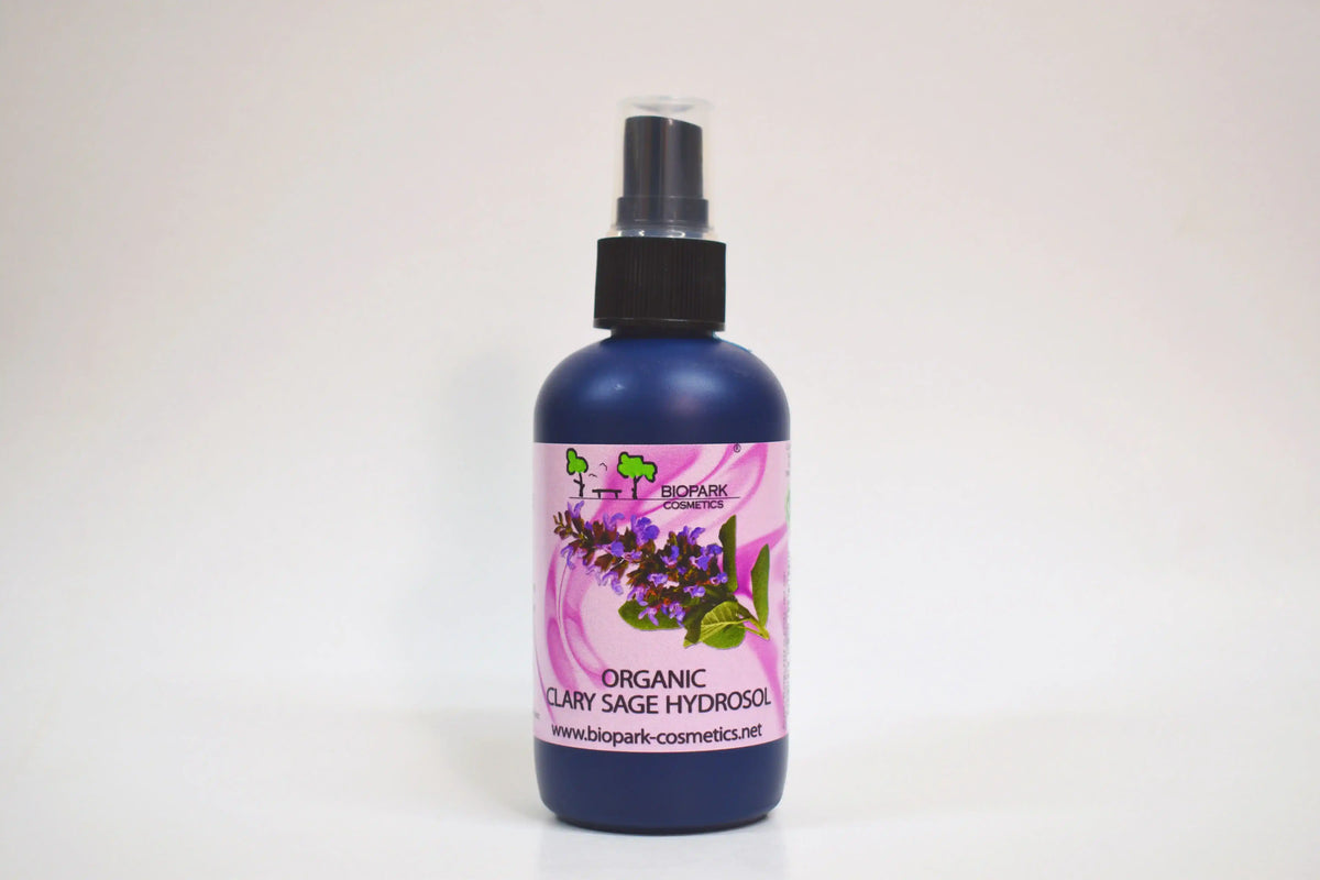 Bottle of organic clary sage hydrosol with a floral label on a white background