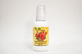 Bottle of organic pomegranate oil with a yellow label on a white background