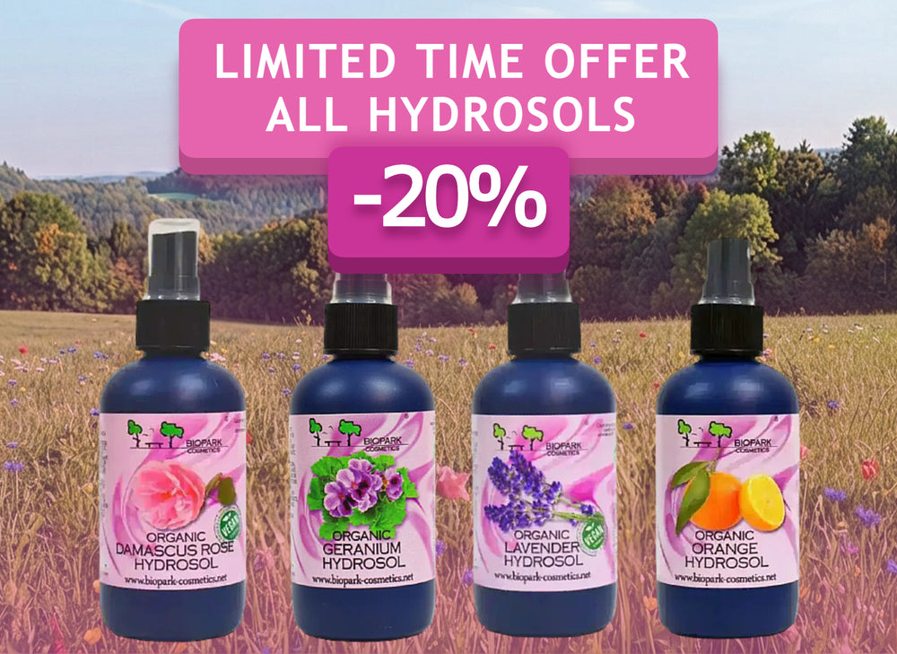 Four bottles of 1 to 1 Naturals hydrosols (Damascus Rose, Geranium, Lavender, and Orange) lined up in a field, with a pink promotional banner overlay reading 'LIMITED TIME OFFER ALL HYDROSOLS -20%'.