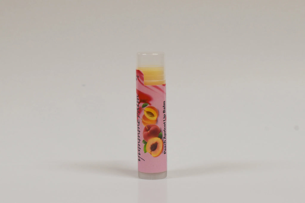 Lip balm with a colorful label featuring fruits on a white background