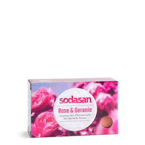 Sodasan Rose & Geranium hand and body cream soap in a rectangular box with a pink rose floral design and a central white oval label.