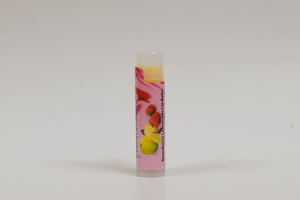 Lip balm with strawberry and lemon flavor on a white background